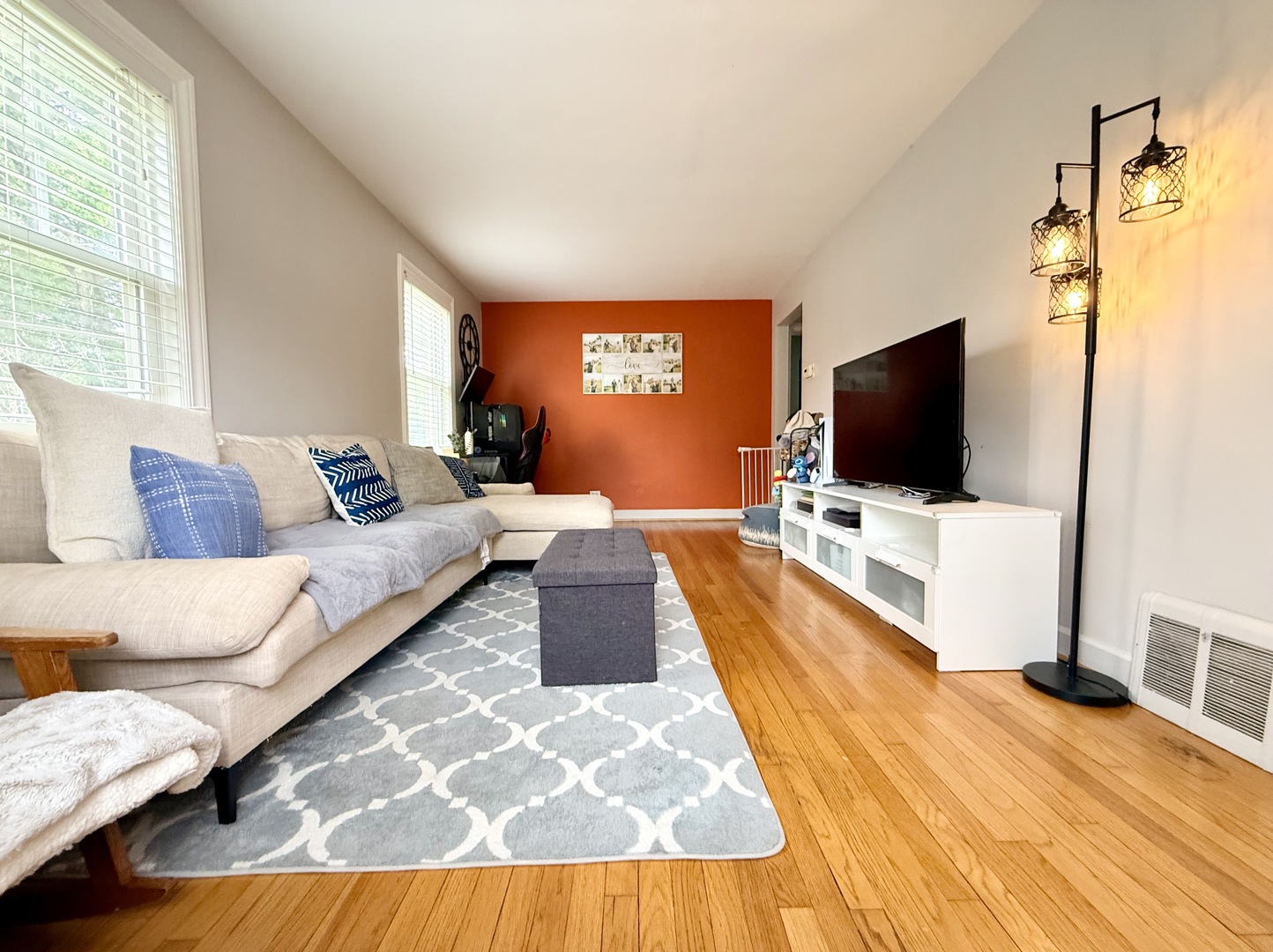 416 North Main Street Mount Prospect, IL 60056 - Photo 2 of 24 a living room with furniture and a flat screen tv
