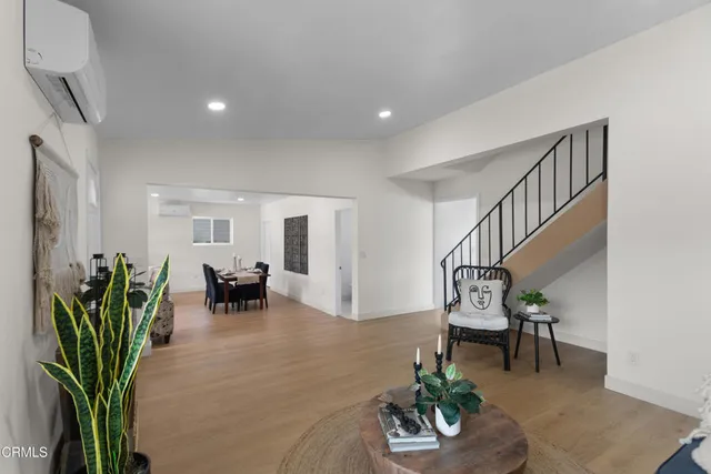 a living room with furniture flowerpot and a potted plant