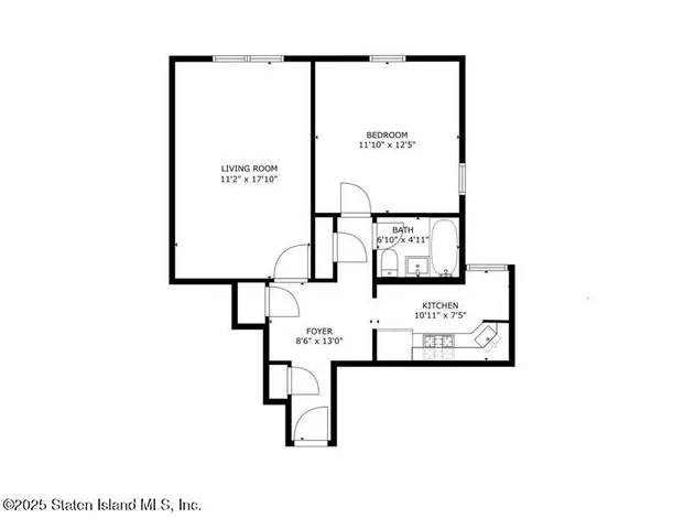 a front view of a house with a yard and a garden