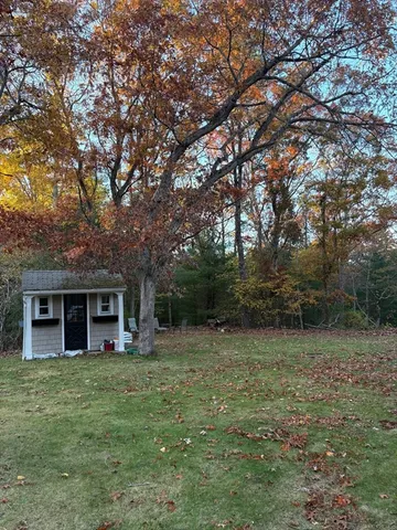 a view of house with yard