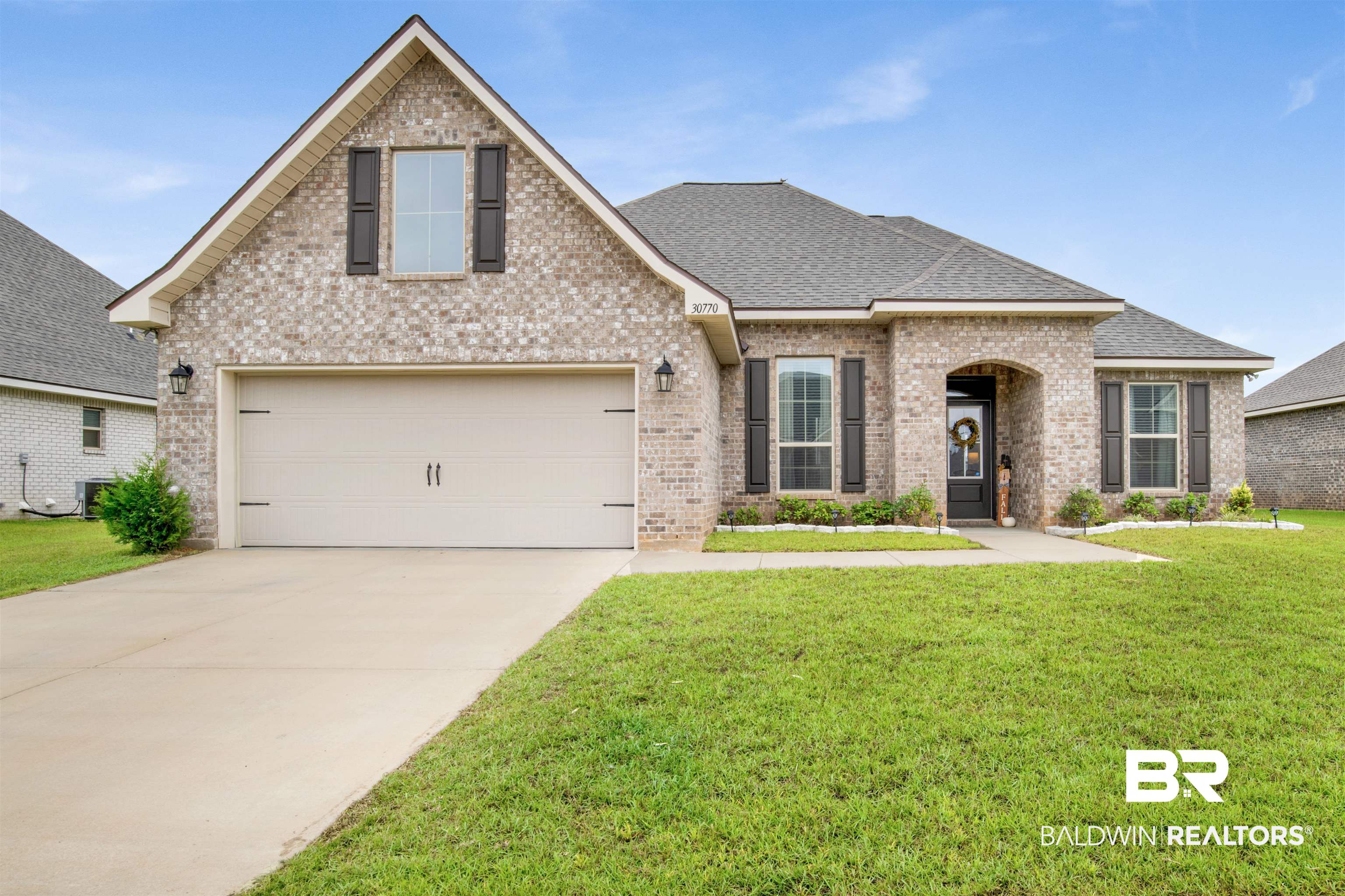 30770 Marcel Boulevard Spanish Fort, AL 36527 - Photo 1 of 23 View of front of property with central AC unit and a front lawn