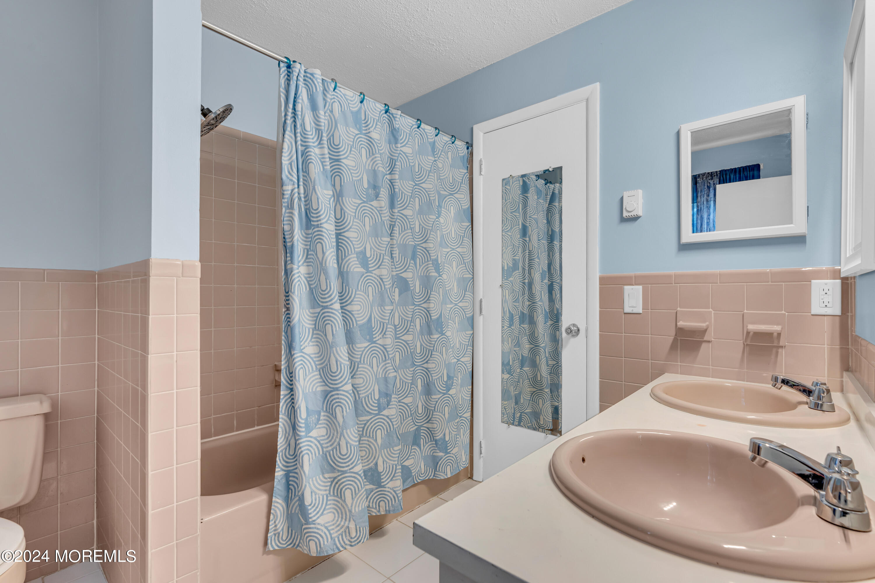 419 Cook Road Jackson, NJ 08527 - Photo 14 of 36 a bathroom with a sink a toilet and shower