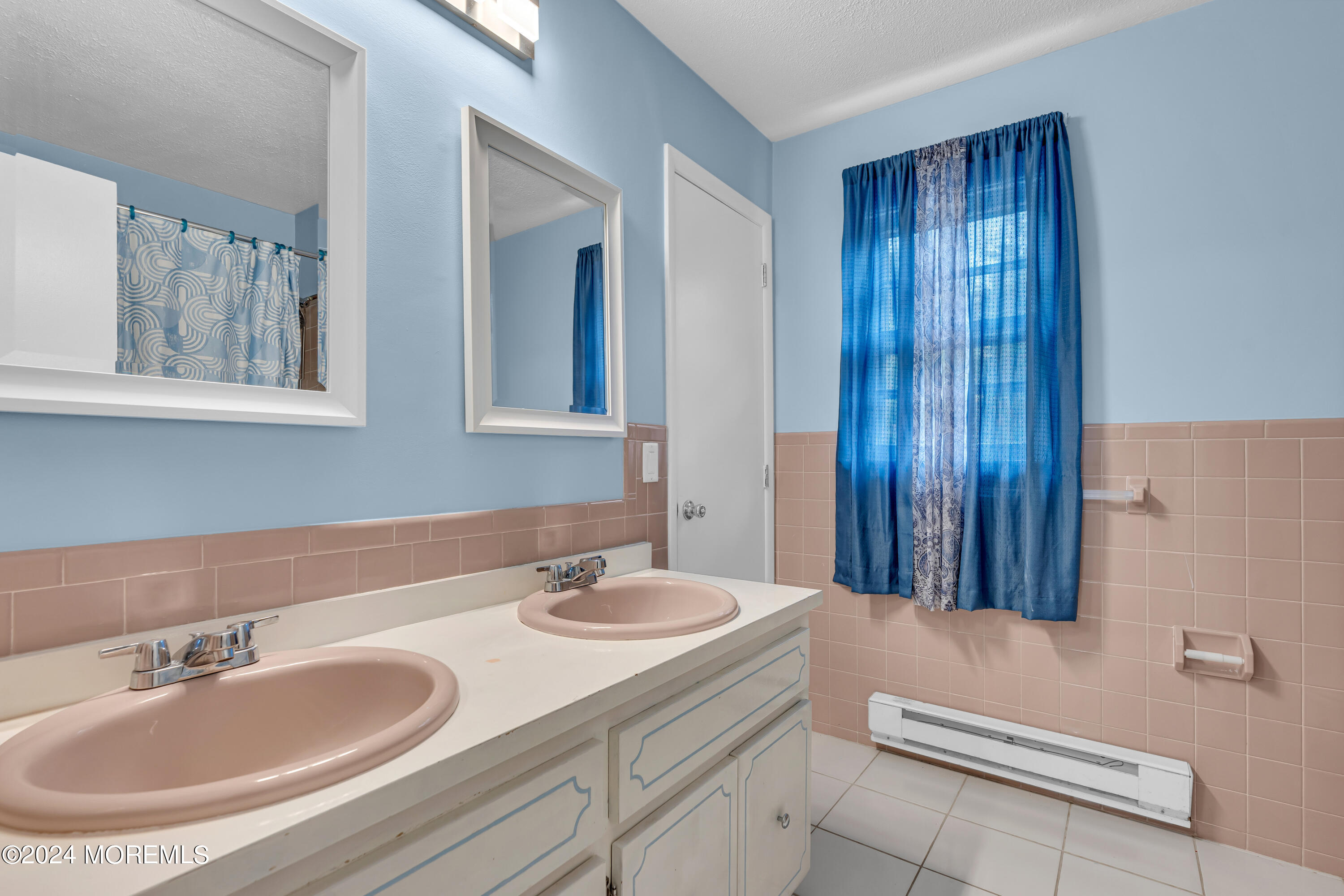 419 Cook Road Jackson, NJ 08527 - Photo 15 of 36 a bathroom with a sink and a mirror