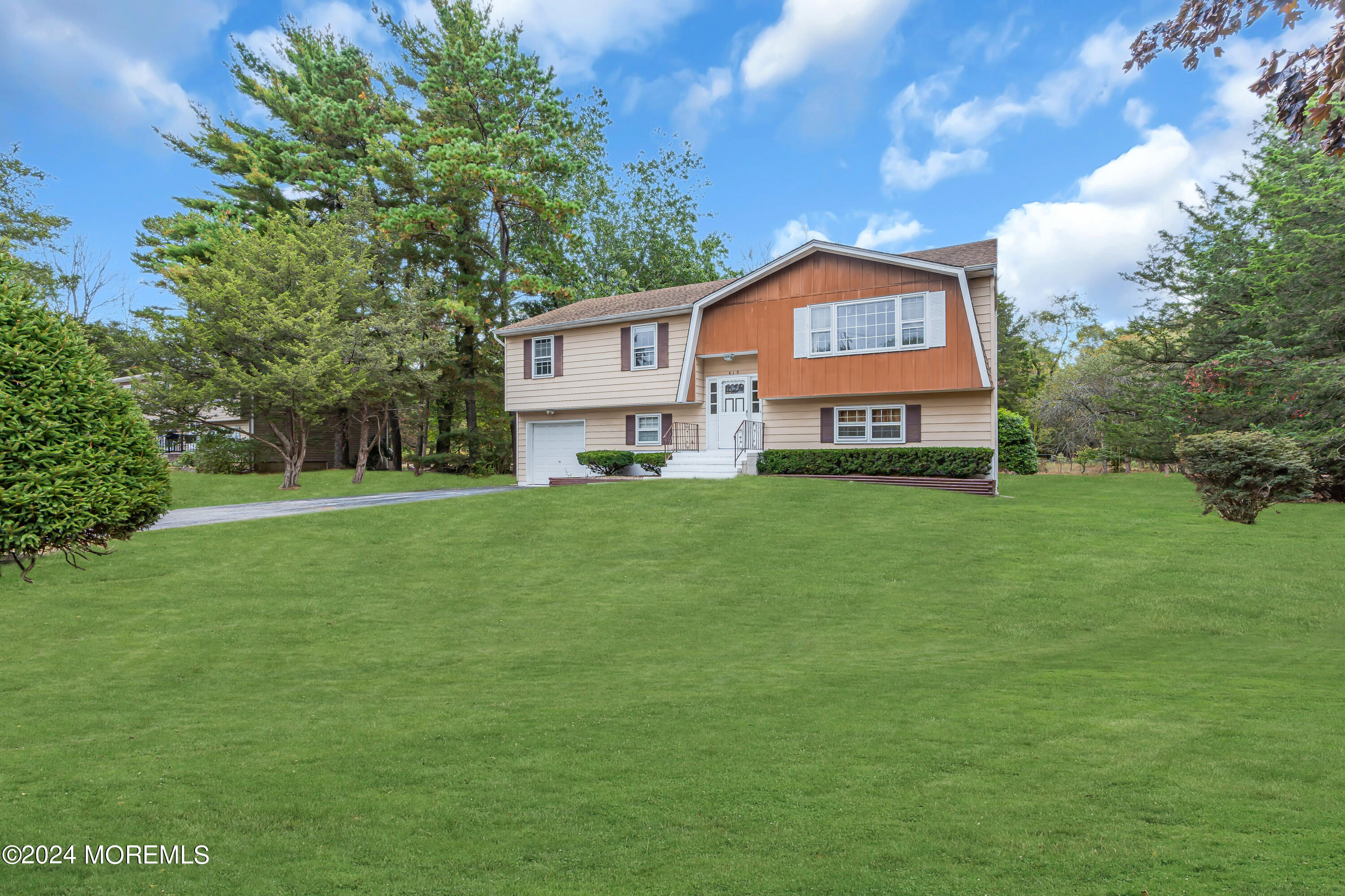 419 Cook Road Jackson, NJ 08527 - Photo 2 of 36 a house view with a garden space