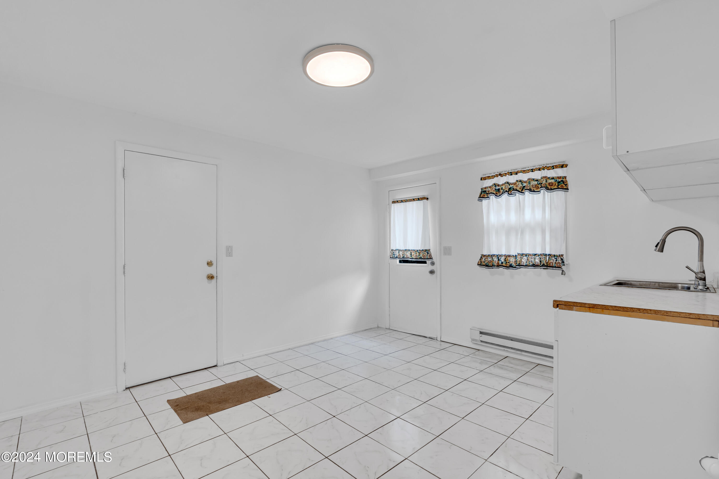 419 Cook Road Jackson, NJ 08527 - Photo 23 of 36 a view of a kitchen with white cabinets