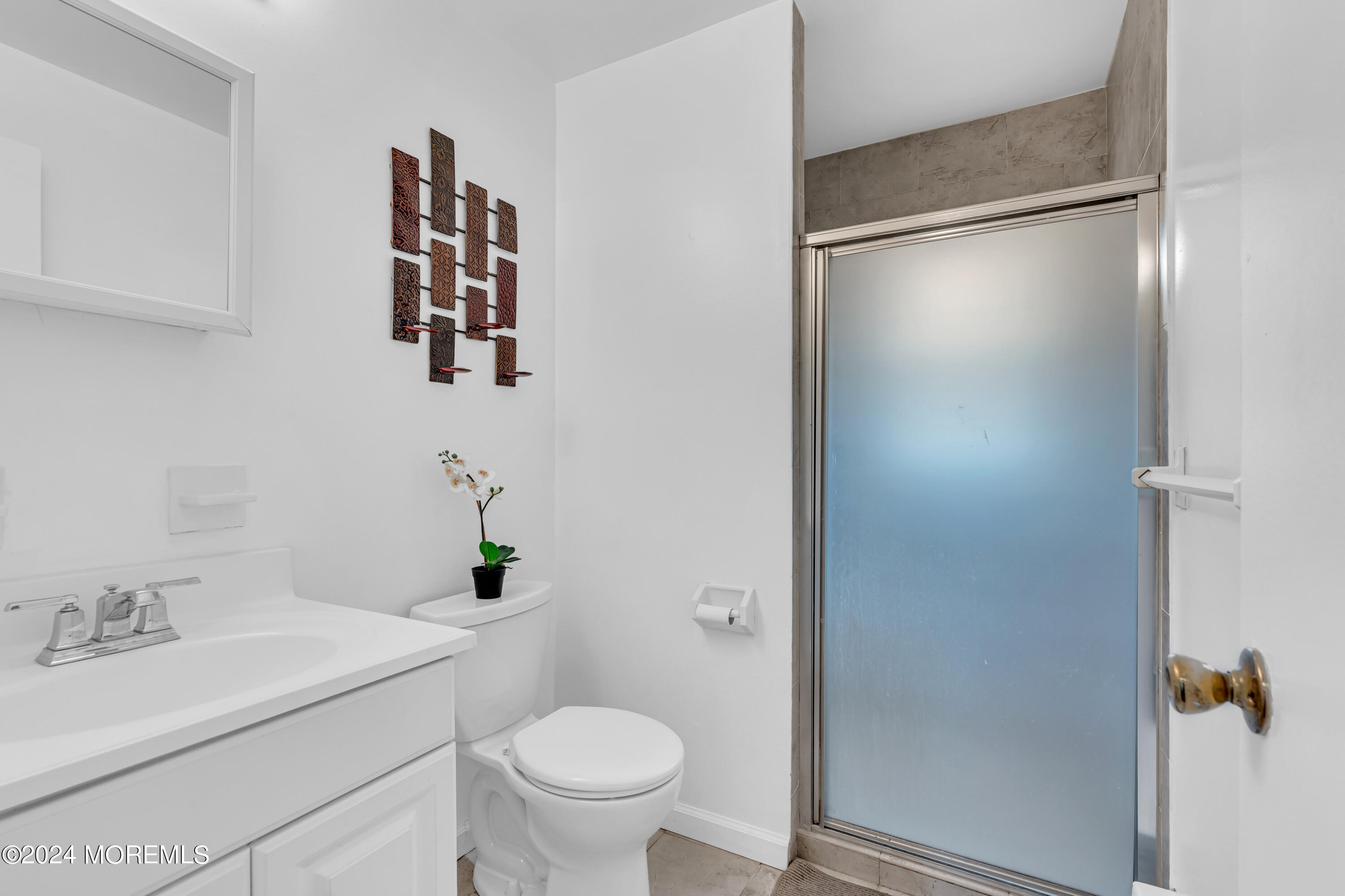 419 Cook Road Jackson, NJ 08527 - Photo 25 of 36 a bathroom with a sink toilet and vanity