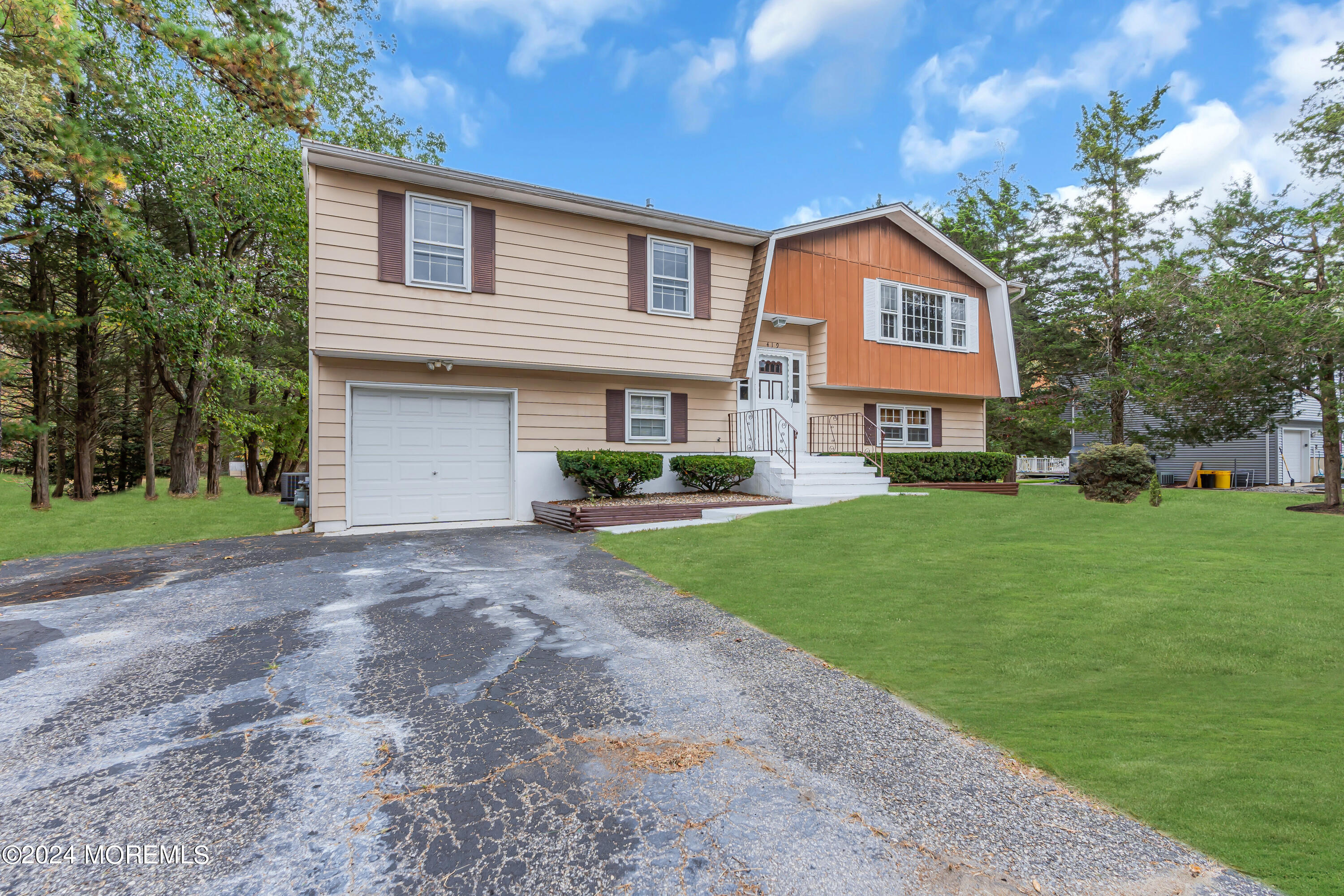 419 Cook Road Jackson, NJ 08527 - Photo 3 of 36 a front view of a house with a yard and street
