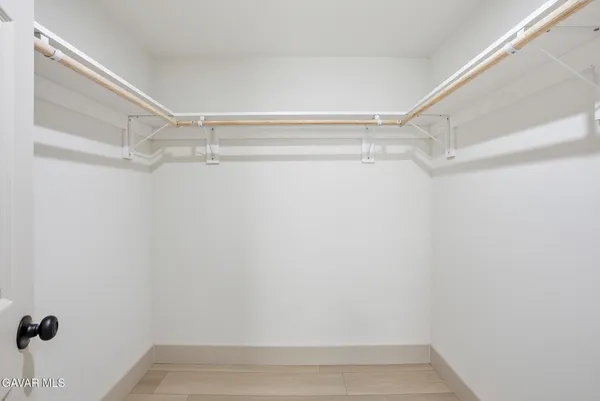 a view of an empty walk in closet