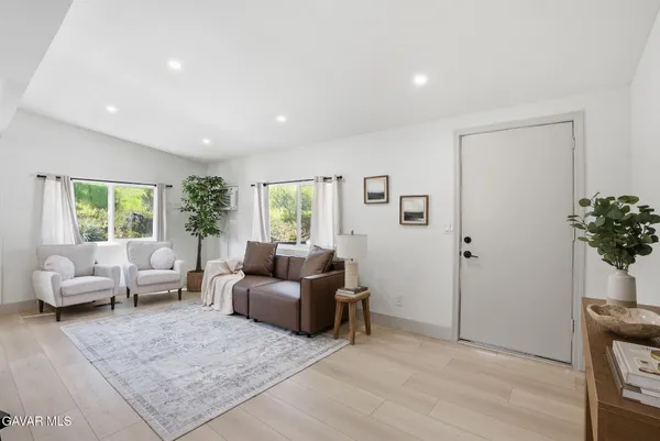 a living room with furniture and a window