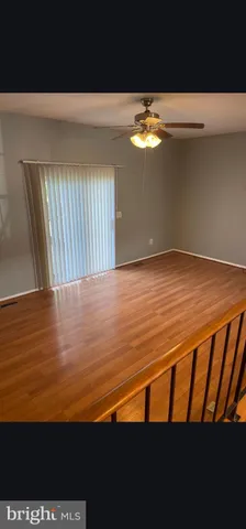 a view of empty room with floor to ceiling window