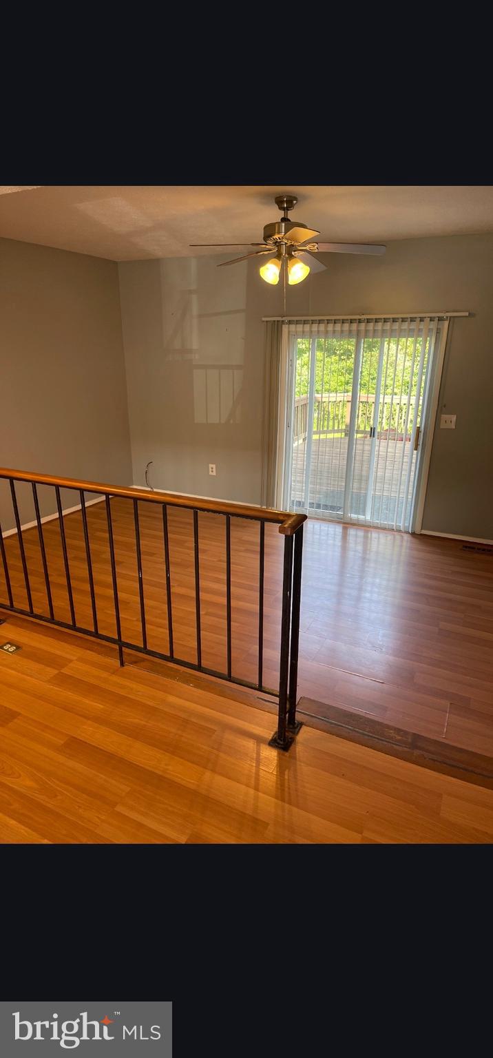822 Joshua Tree Court Owings Mills, MD 21117 - Photo 26 of 27 a view of empty room with wooden floor