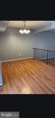 a view of a big room with wooden floor