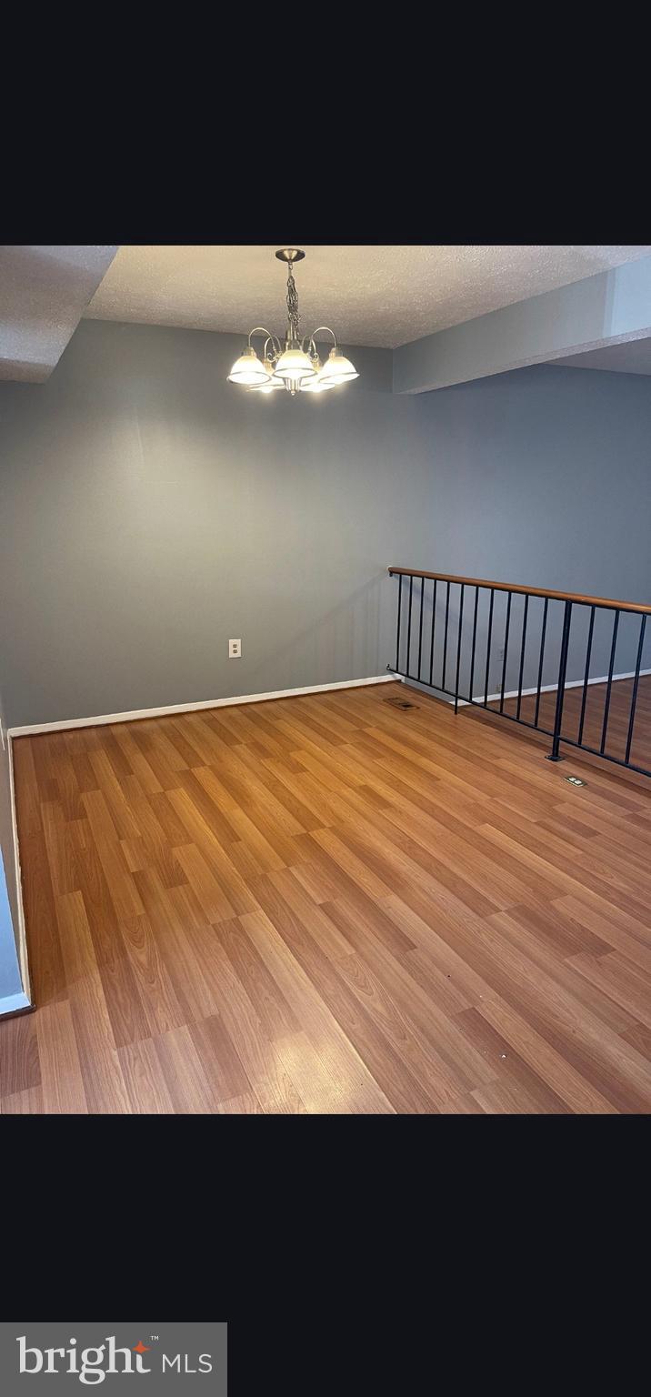 822 Joshua Tree Court Owings Mills, MD 21117 - Photo 27 of 27 a view of a big room with wooden floor