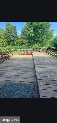 a view of a swimming pool with a yard