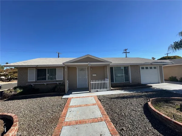 a front view of a house with yard