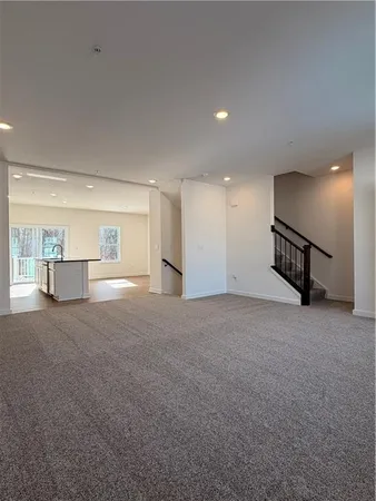 a view of a kitchen with a sink and cabinets