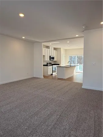 a view of an empty room with a windows