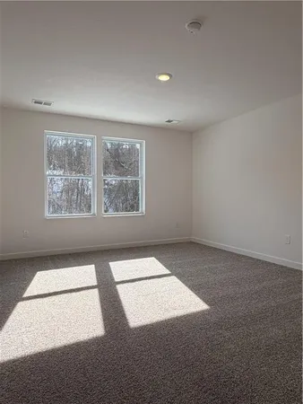 an empty room with closet area