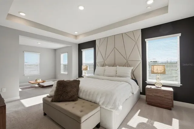 a bedroom with a bed and a couch