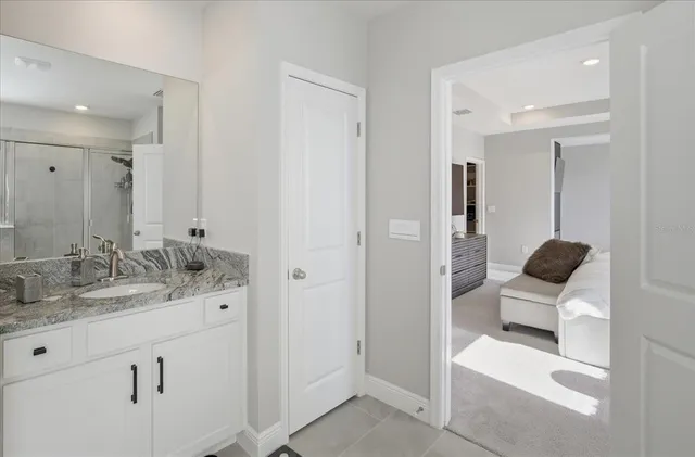 a bathroom with a sink and a mirror