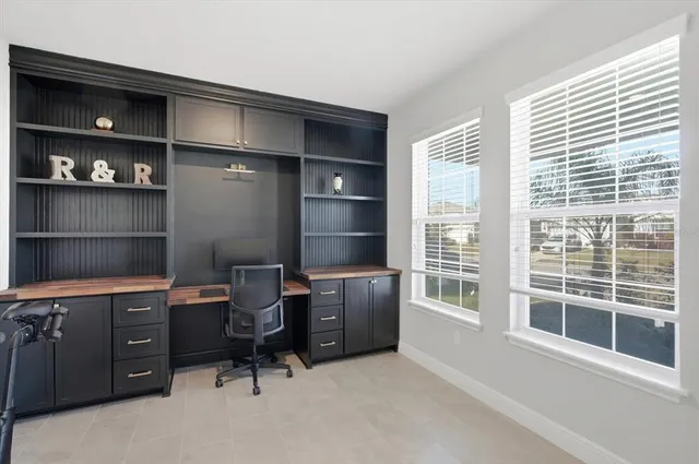 a workspace with furniture and windows