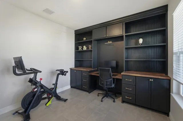 a view of a workspace with furniture