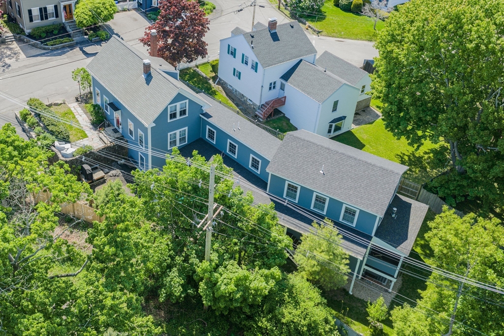 27 Maverick Street Marblehead, MA 01945 - Photo 2 of 31 an aerial view of a house with a yard and an outdoor seating