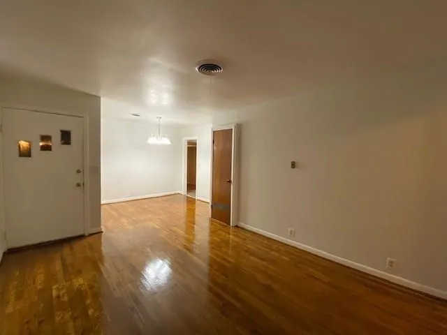 a view of a livingroom with wooden floor