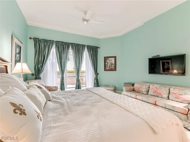 a bedroom with a bed and a couch