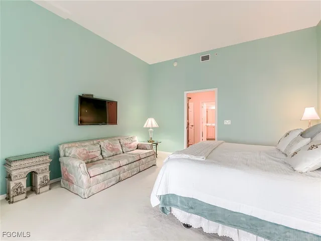 a living room filled with furniture and a window