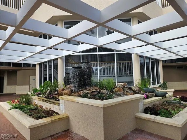 a view of a chairs and table in patio