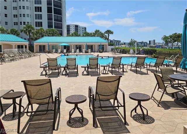 a view of a pool with a ocean view