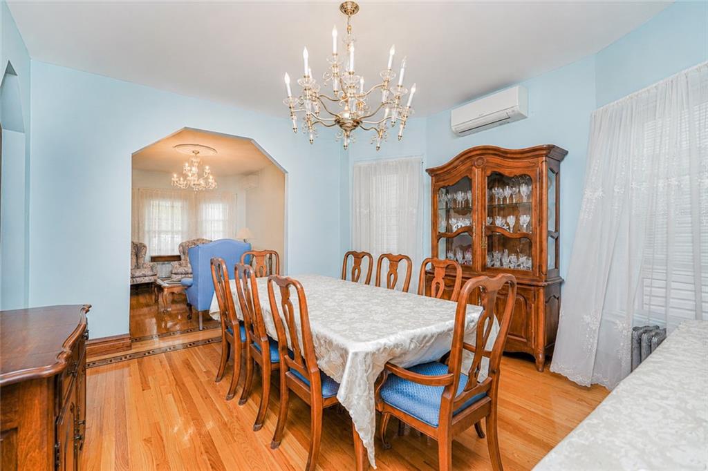 1352 Bay Ridge Parkway Brooklyn, NY 11228 - Photo 15 of 42 a view of a dining room with furniture and chandelier