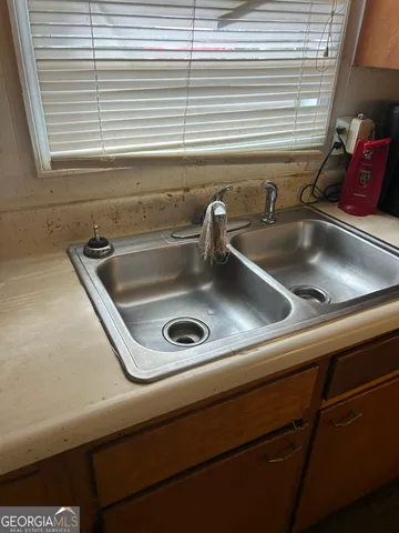 a kitchen with a stove and a refrigerator