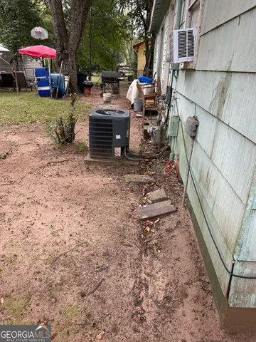 a view of backyard with outdoor seating