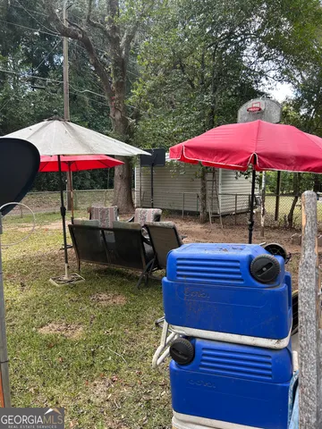 a view of swimming pool with a patio