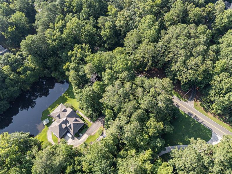 257 Ranchette Road Alpharetta, GA 30004 - Photo 12 of 17 an aerial view of residential house with outdoor space and trees all around