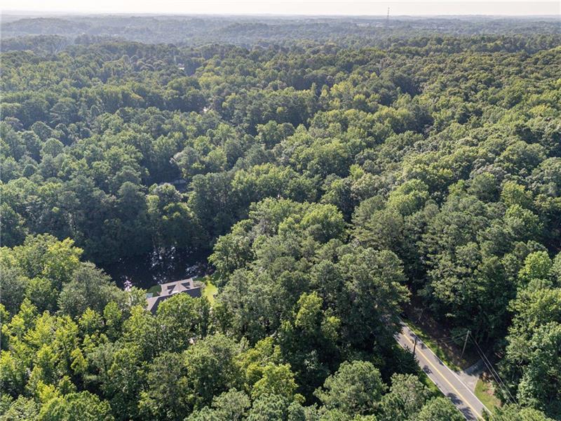 257 Ranchette Road Alpharetta, GA 30004 - Photo 13 of 17 an aerial view of house with yard and mountain view