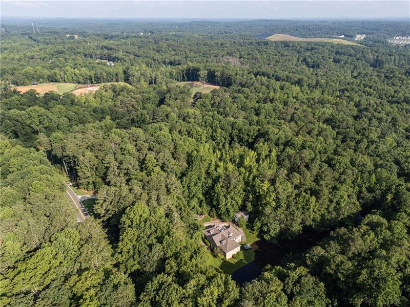 257 Ranchette Road Alpharetta, GA 30004 - Photo 7 of 17 an aerial view of residential house with outdoor space and trees all around