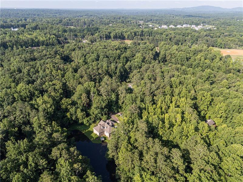 257 Ranchette Road Alpharetta, GA 30004 - Photo 9 of 17 an aerial view of residential houses with outdoor space and trees
