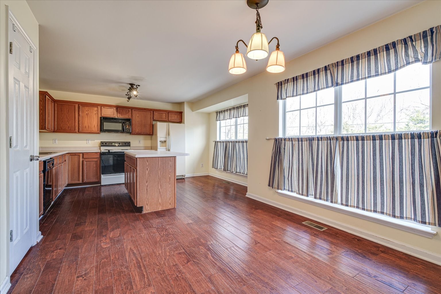 480 Huntington Ridge Drive Nashville, TN 37211 - Photo 11 of 21 a view of kitchen with granite countertop microwave stove top oven and cabinets