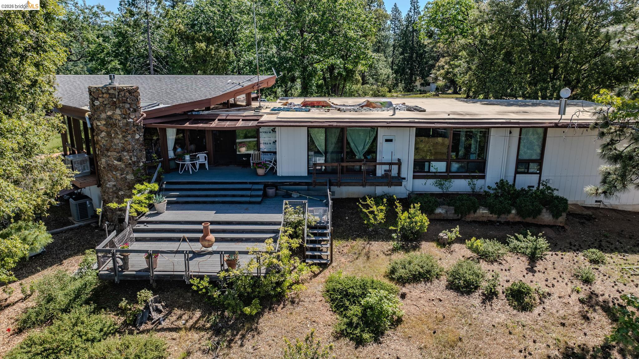 6161 Fullen Road Murphys, CA 95247 - Photo 2 of 53 a view of a house with wooden deck and furniture