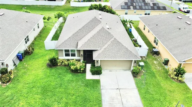 a aerial view of a house with garden