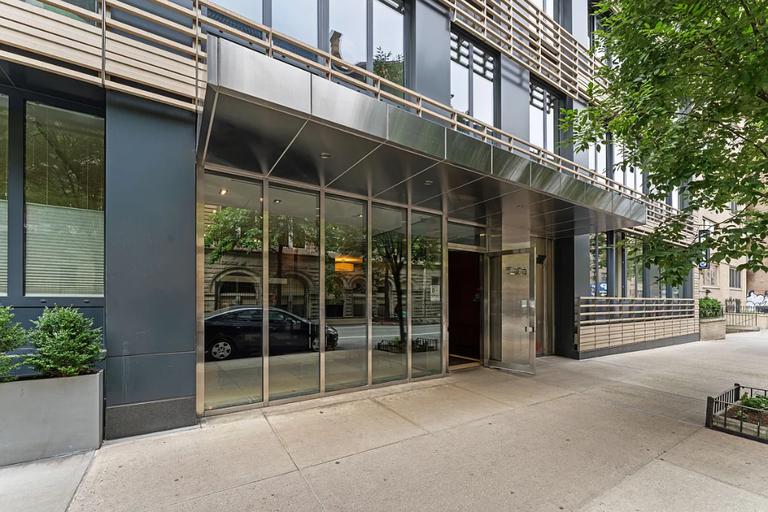 50 West 15th Street, Unit 8B Manhattan, NY 10011 - Photo 5 of 9 a view of a house with a large window and wooden fence