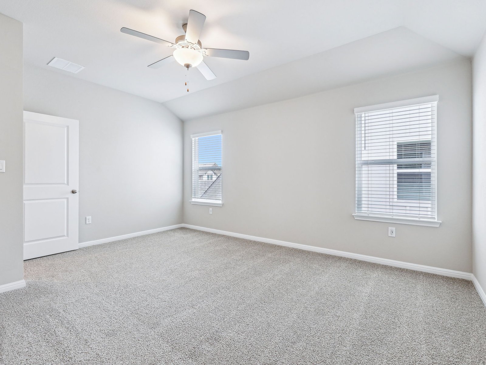 113 Maple Hedge Road Hutto, TX 78634 - Photo 11 of 20 an empty room with windows and fan