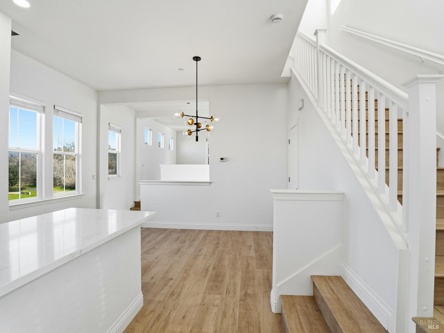 4424 Streamside Drive Santa Rosa, CA 95409 - Photo 20 of 55 a view of an empty room with wooden floor and a window