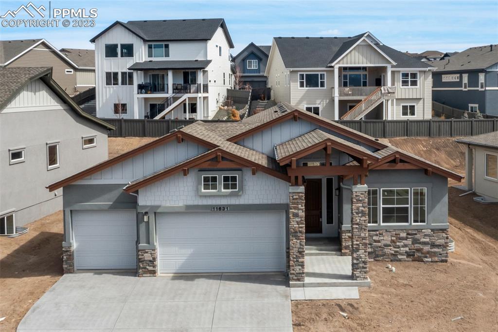 11631 Silver Charm Way Colorado Springs, CO 80921 - Photo 1 of 29 a front view of a house with a garage
