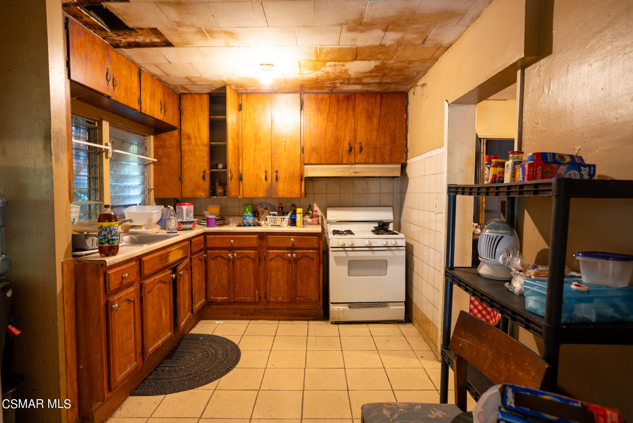 5829 Tipton Way Los Angeles, CA 90042 - Photo 2 of 20 a kitchen with a sink appliances and cabinets