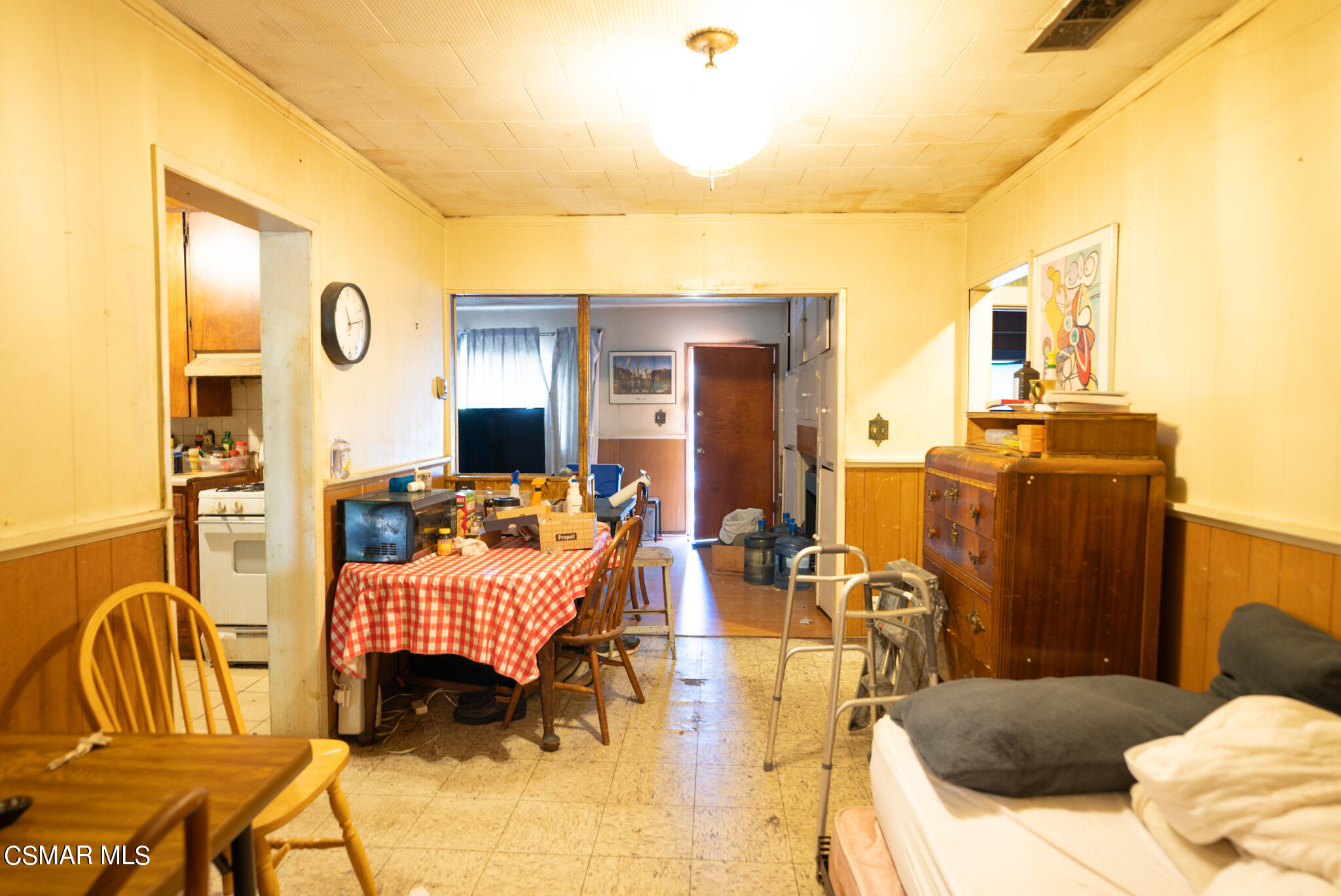 5829 Tipton Way Los Angeles, CA 90042 - Photo 5 of 20 a bedroom with furniture and a flat screen tv
