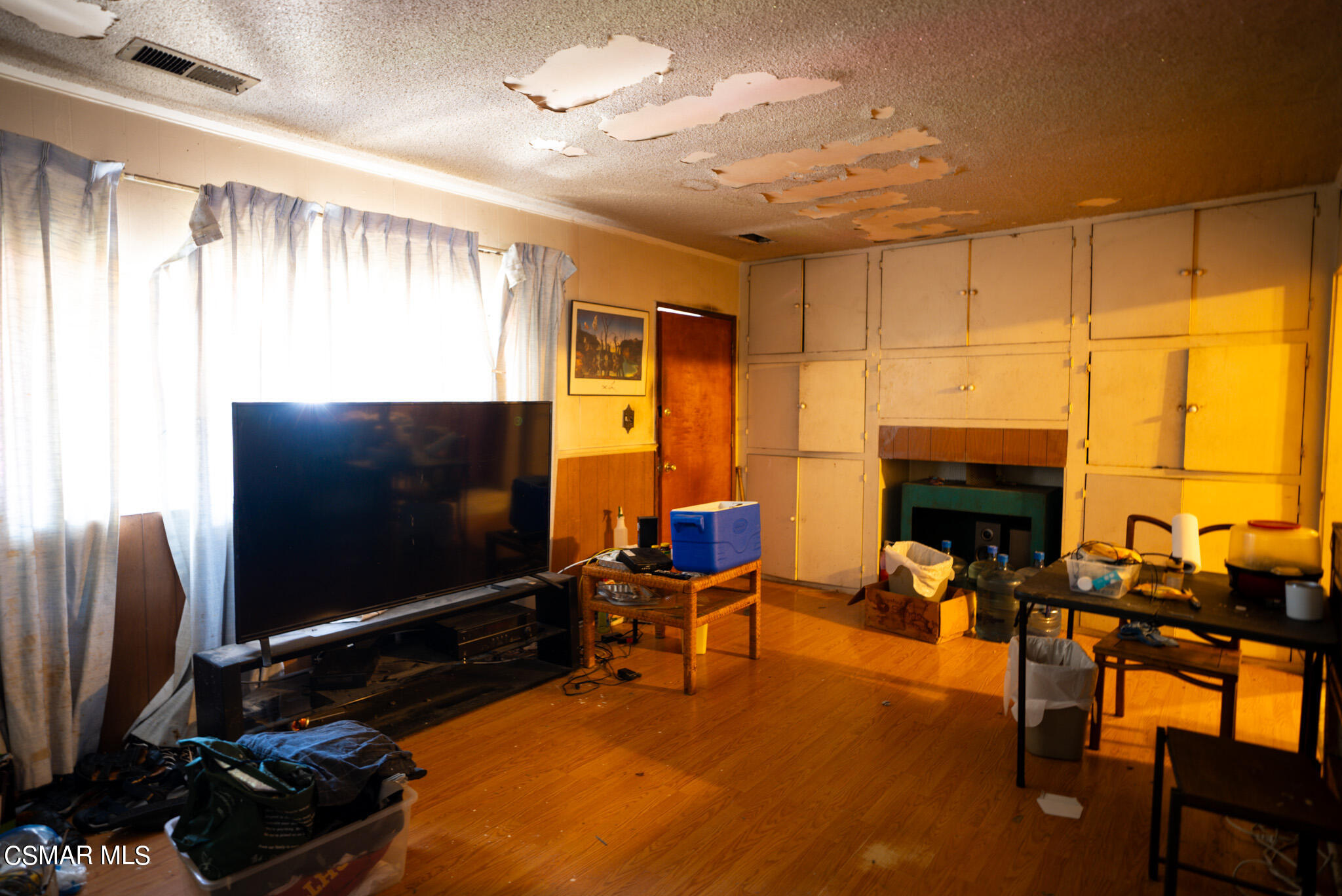 5829 Tipton Way Los Angeles, CA 90042 - Photo 6 of 20 a living room with furniture fireplace and flat screen tv